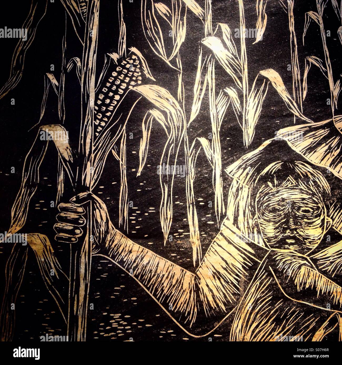 An advertising of the Zapatista Army of National Liberation movement showing the image of a woman holding a corn plant while carrying his son decorates a wall in Colonia Roma, Mexico City, Mexico - Smartphone Captured Stock Image