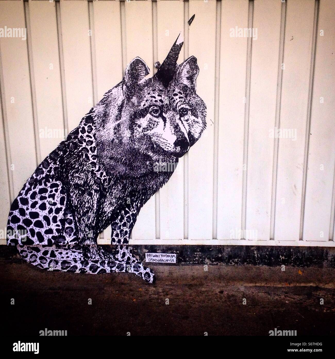 A fantastic animal, mixing an unicorn, a wolf and a cheetah created by artist Diana Garcia decorates Delirio restaurant in Colima street, Colonia Roma, Mexico City,Mexico - Smartphone Captured Stock Image