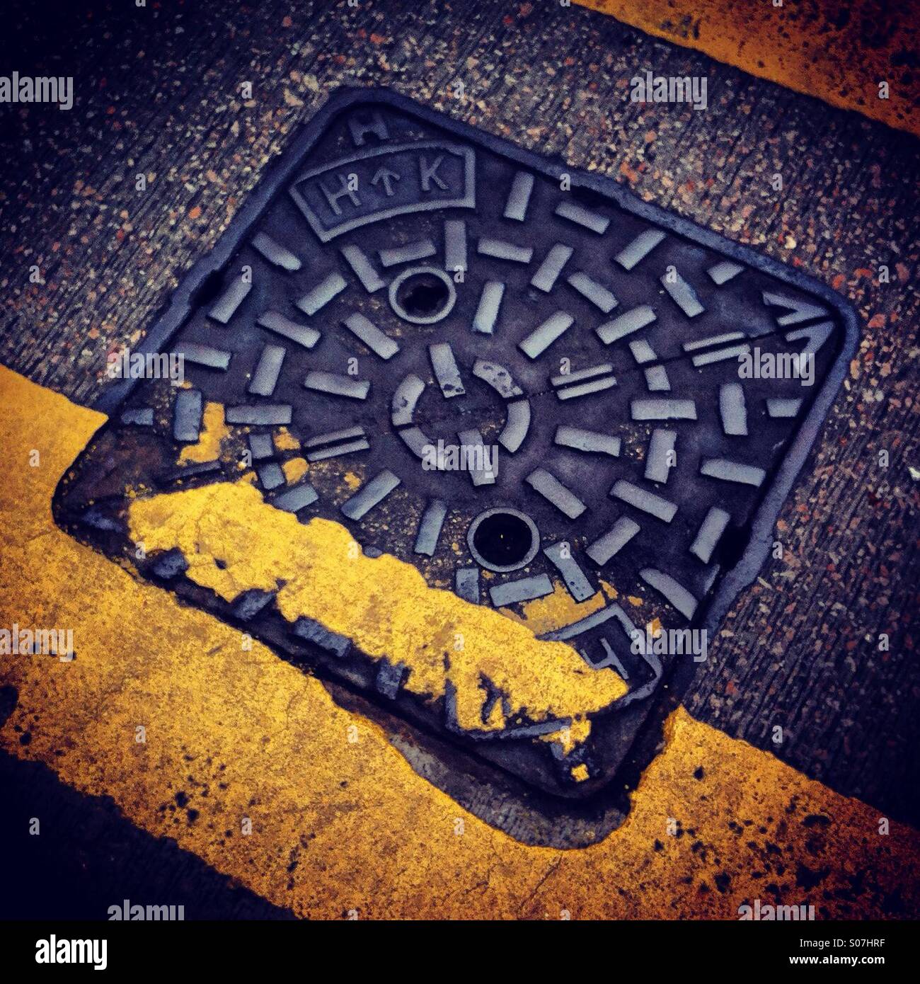 Square shape sewer on the road - Smartphone Captured Stock Image
