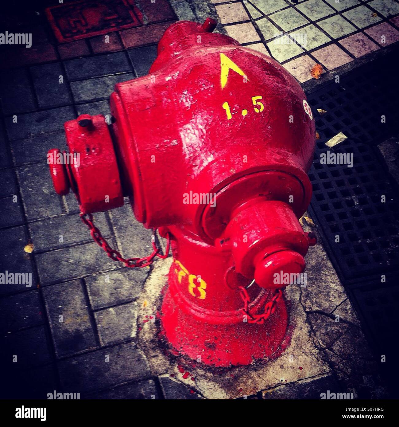 Red fire hydrant on the street in hong kong sidewalk - Smartphone Captured Stock Image