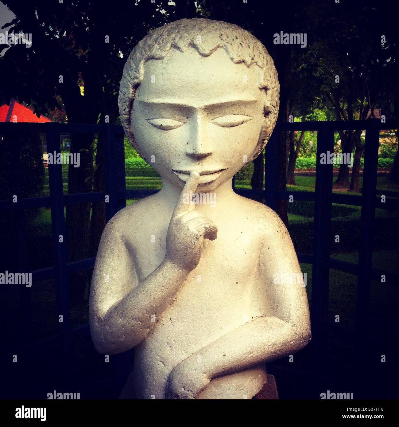 Silence statue little child in a park Stock Photo
