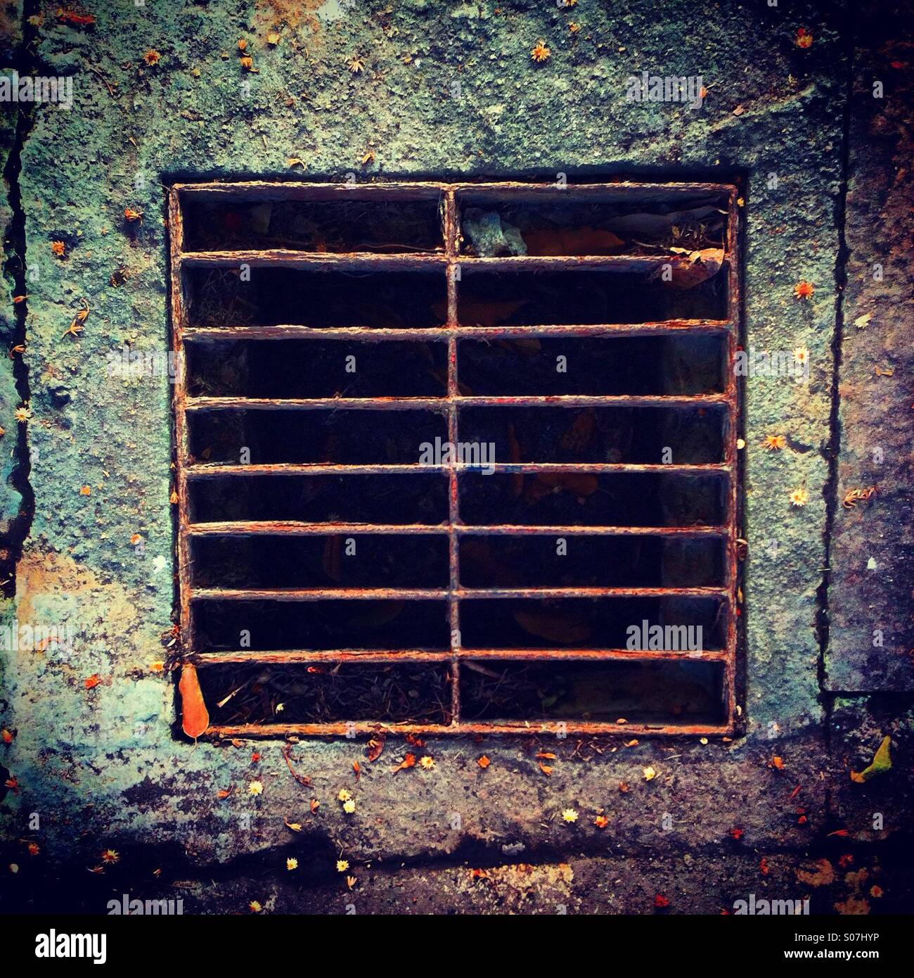 Square sewer with grid on the floor - Smartphone Captured Stock Image