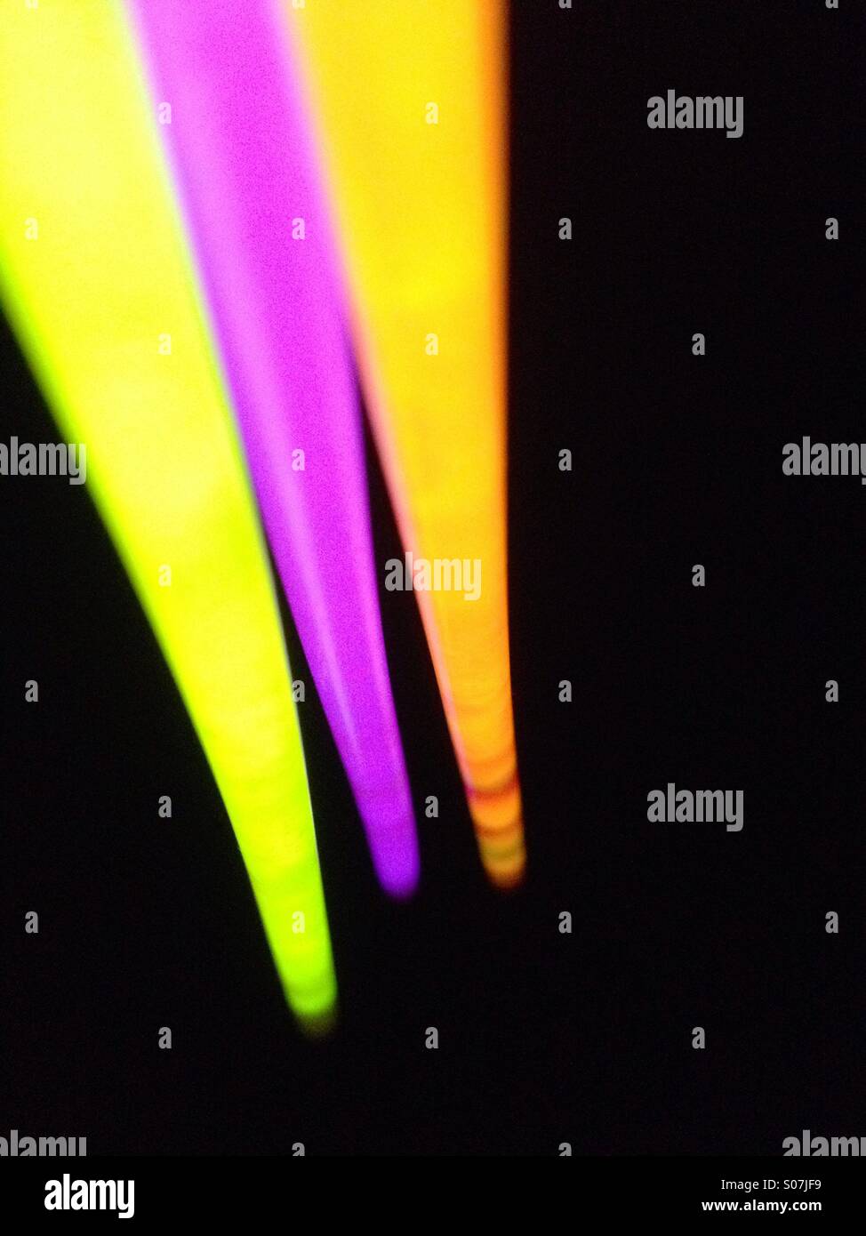 Neon coloured glow sticks - Smartphone Captured Stock Image