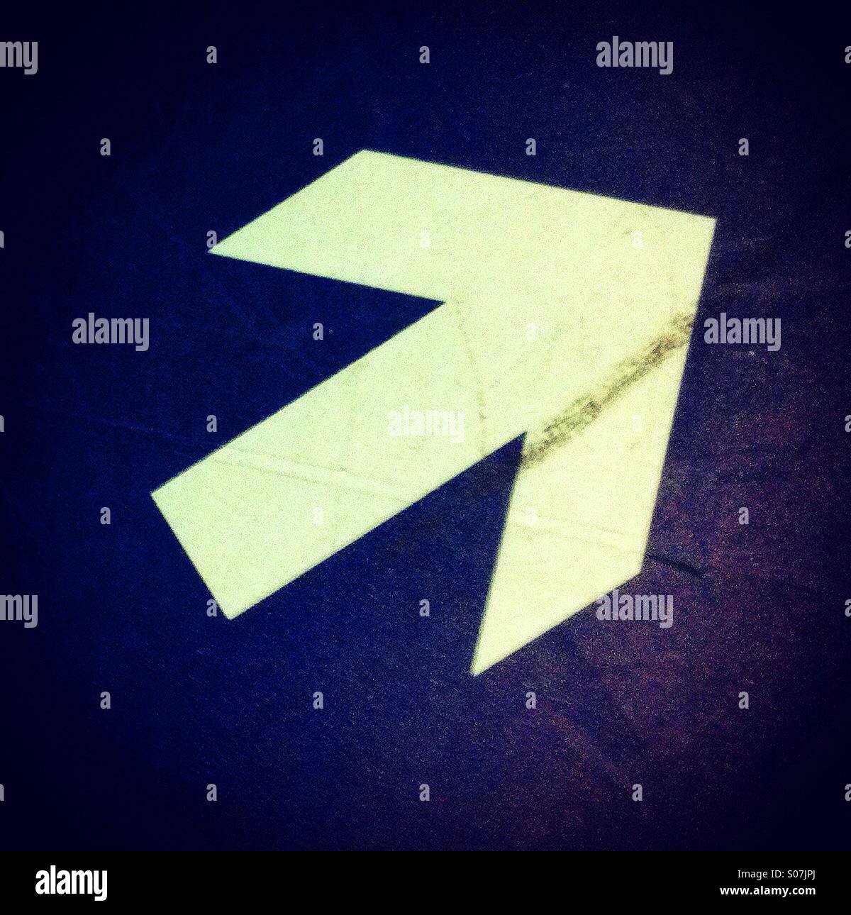 White arrow showing this way - Smartphone Captured Stock Image