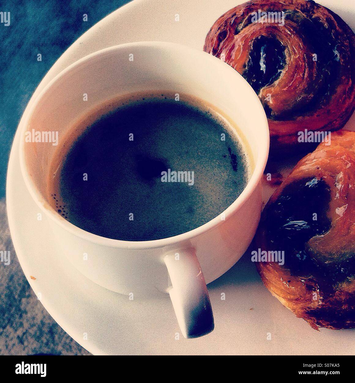 Morning black coffee with pastries - Smartphone Captured Stock Image