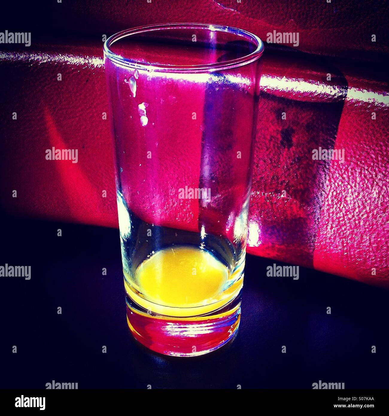 Empty glass of orange juice - Smartphone Captured Stock Image