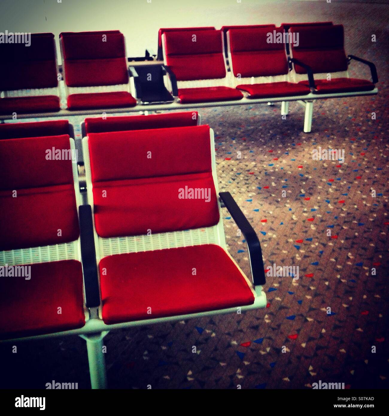 Empty seats at the departure gate of an airport - Smartphone Captured Stock Image