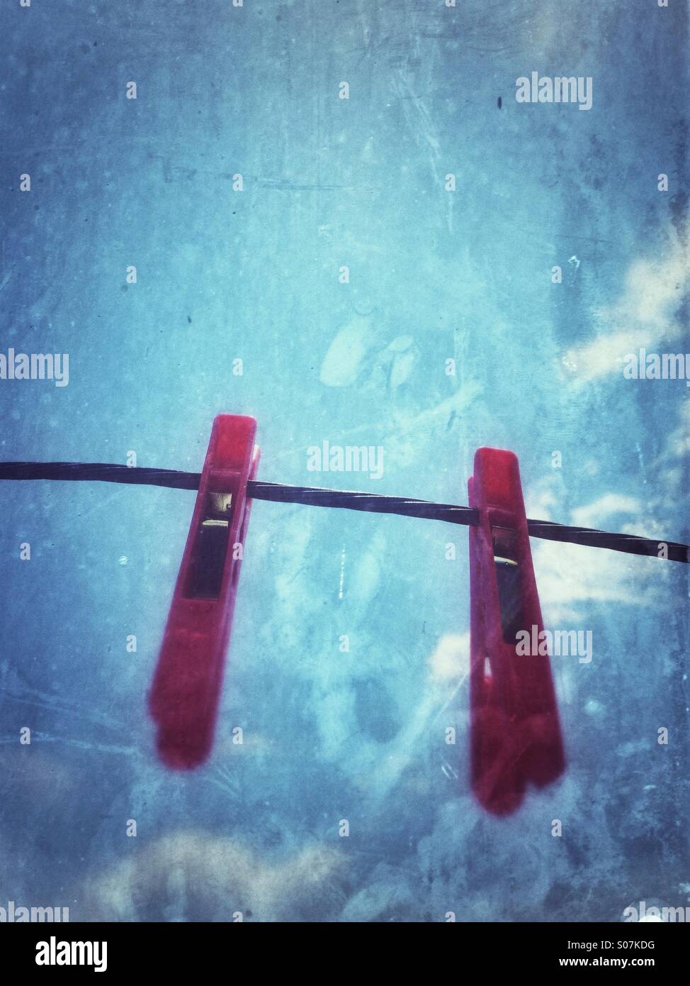 Two cloth pegs on the line. - Smartphone Captured Stock Image