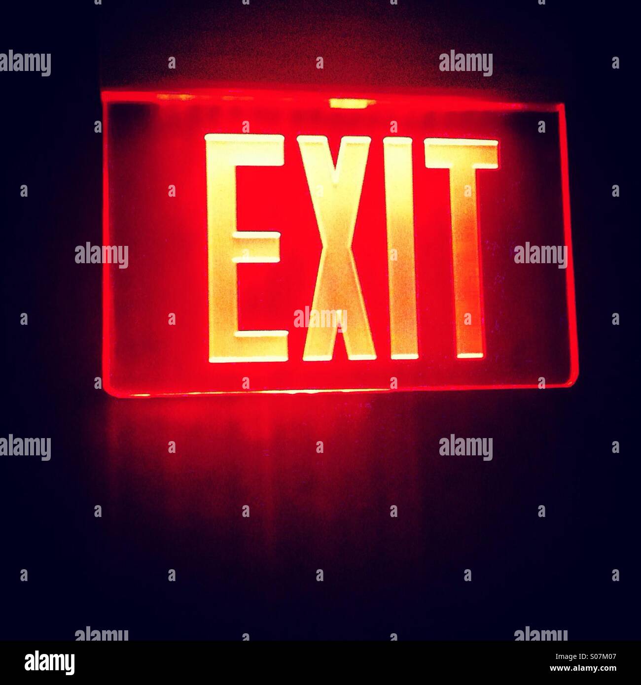 Red exit glowing sign Stock Photo