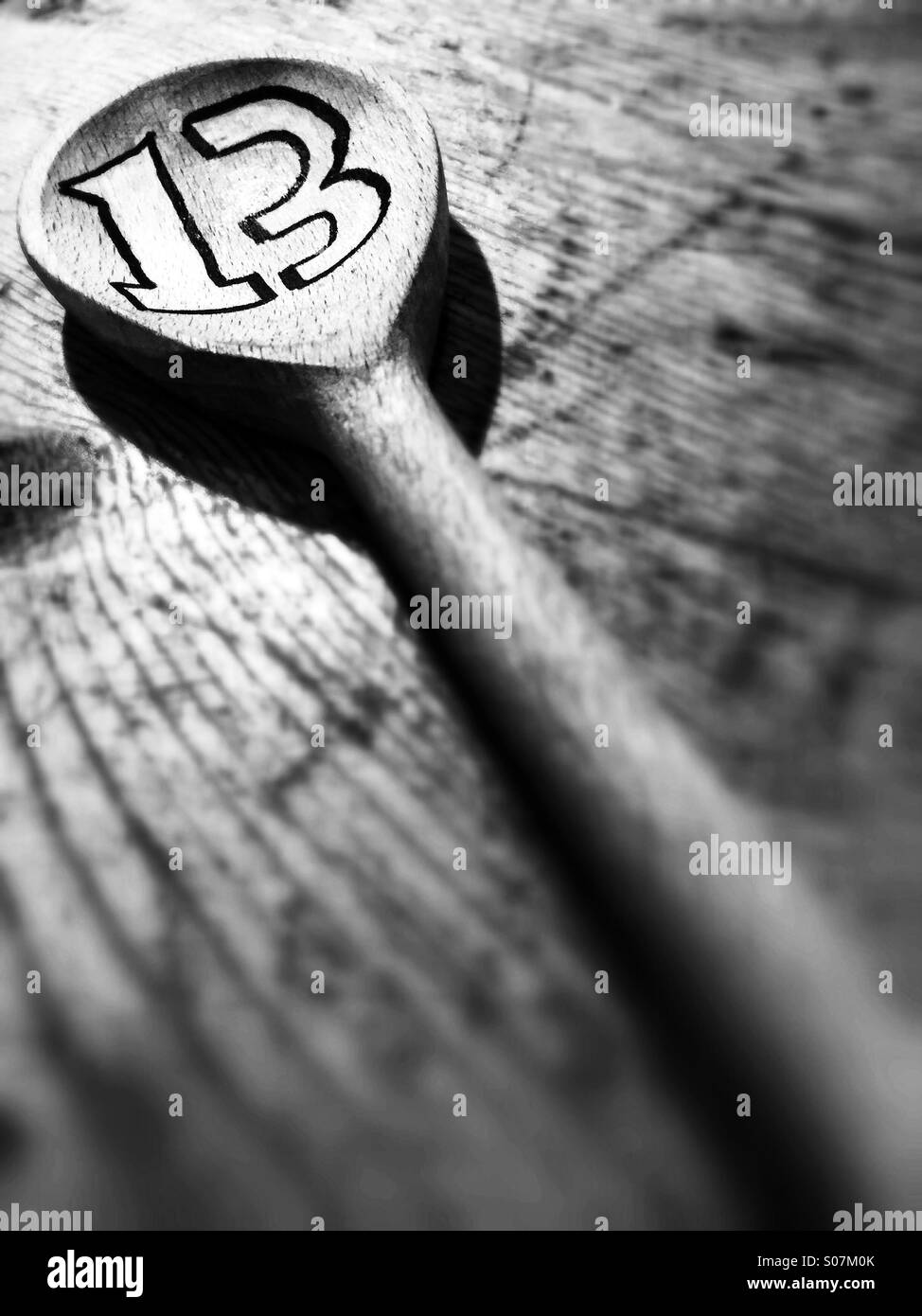 A wooden spoon with the number 13 - Smartphone Captured Stock Image