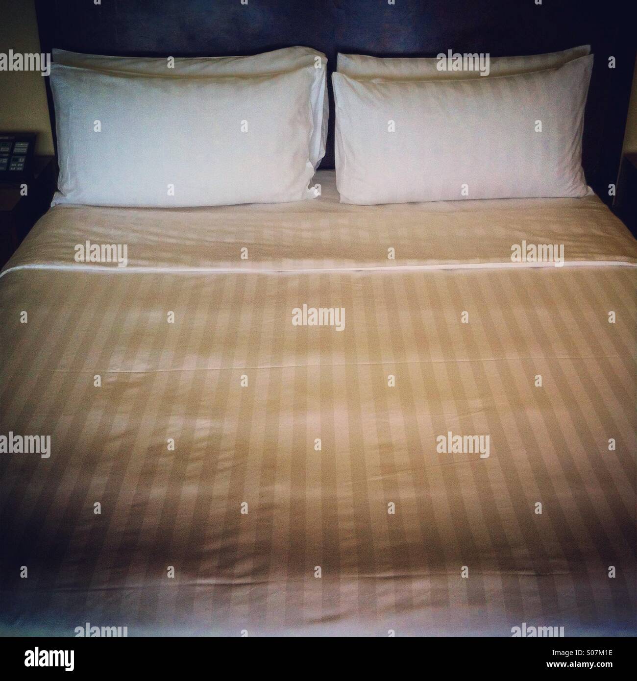 King size bed in hotel room - Smartphone Captured Stock Image