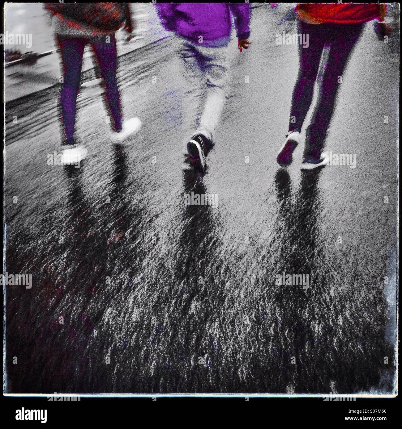 People walking along the street Stock Photo