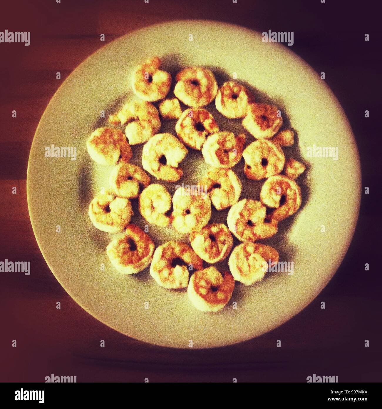 King prawns on a white plate - Smartphone Captured Stock Image