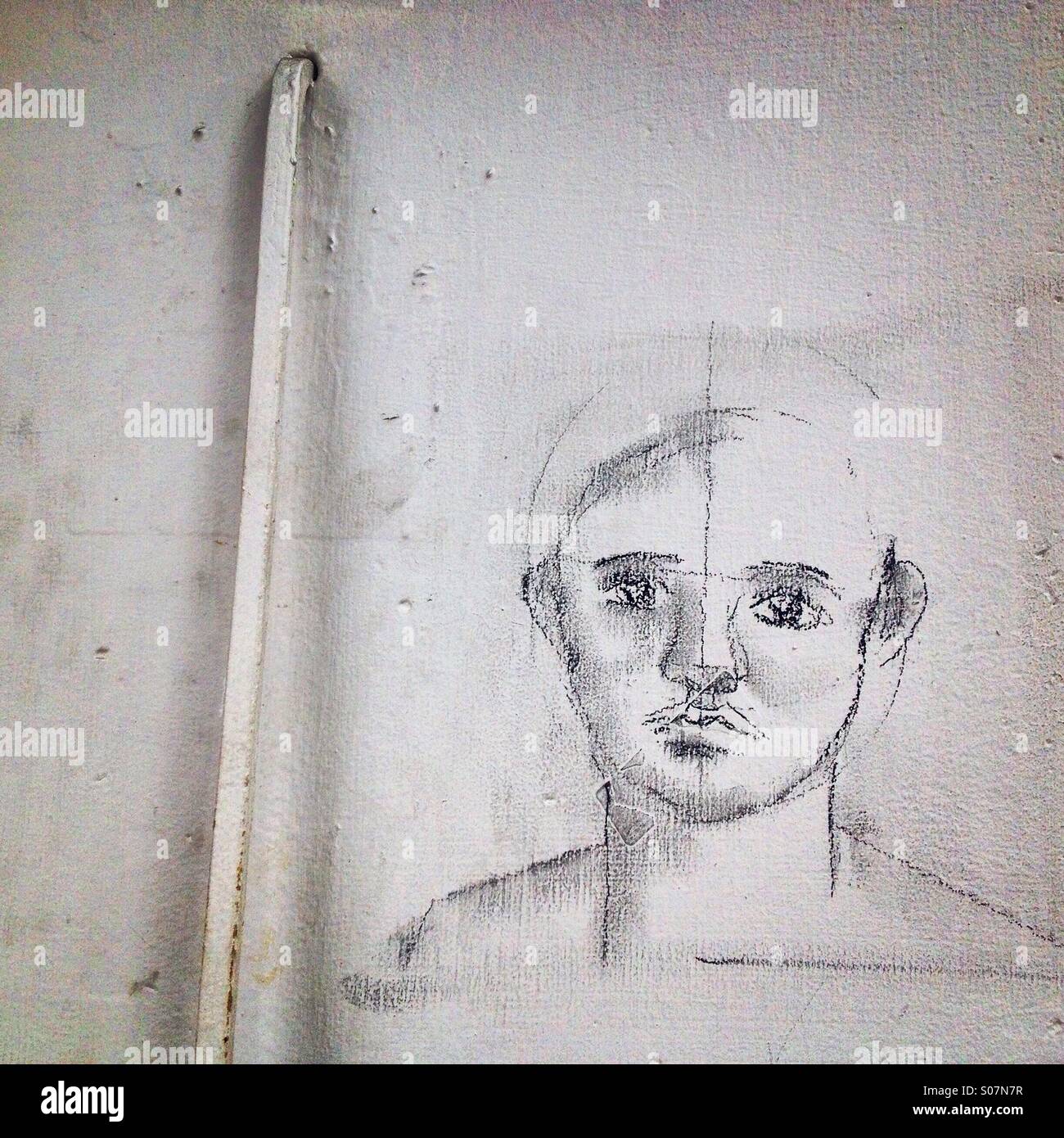 A drawing decorates a wall as a form of protest demanding justice for the 43 missing students of Ayotzinapa, Guerrero, Mexico - Smartphone Captured Stock Image