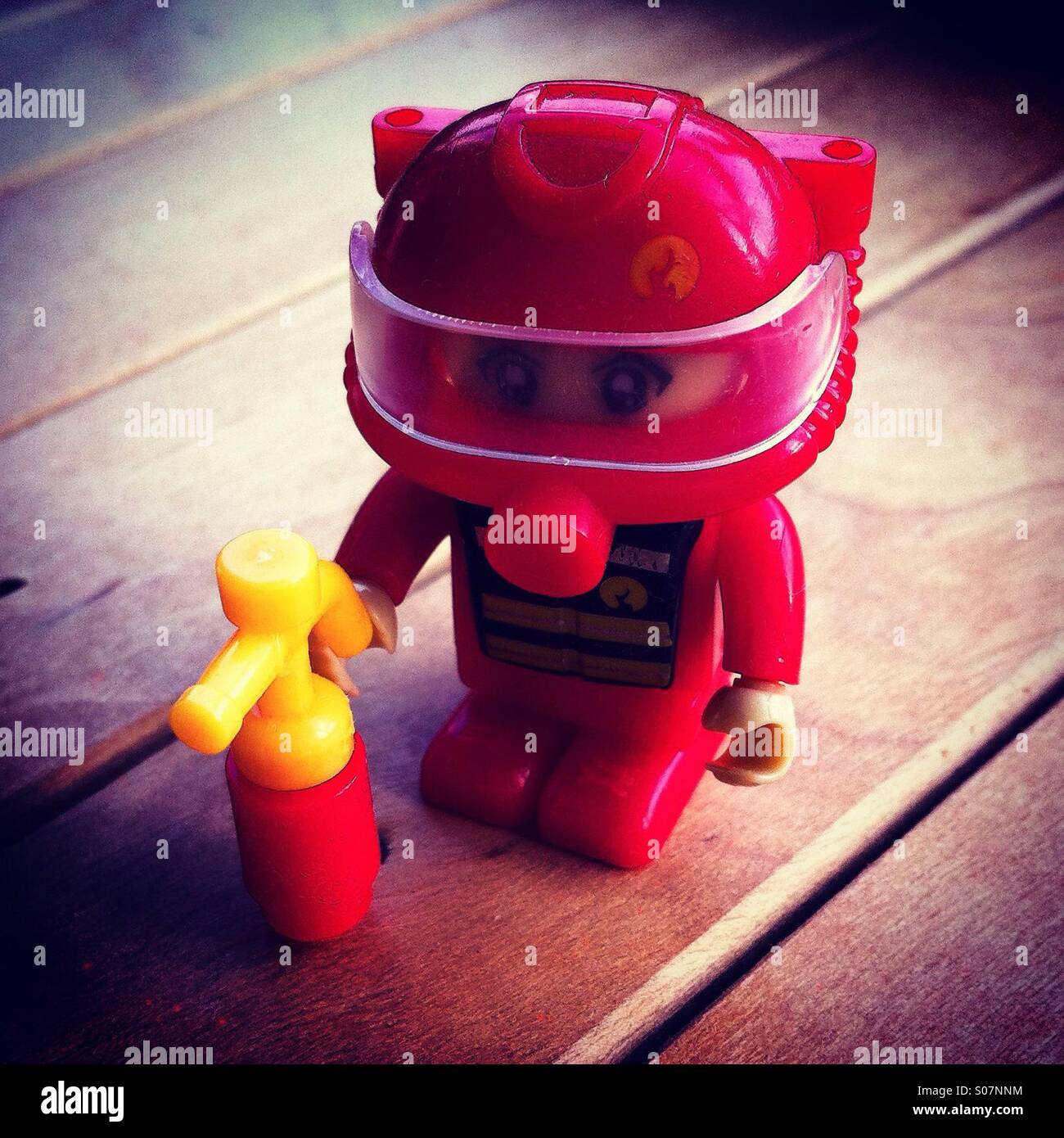Fireman toy in red color Stock Photo