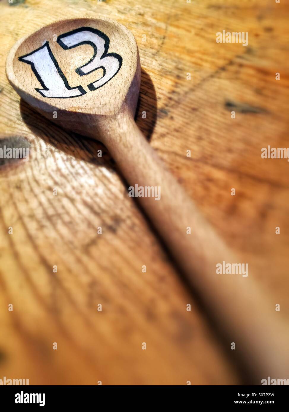 A wooden spoon with the number 13 - Smartphone Captured Stock Image