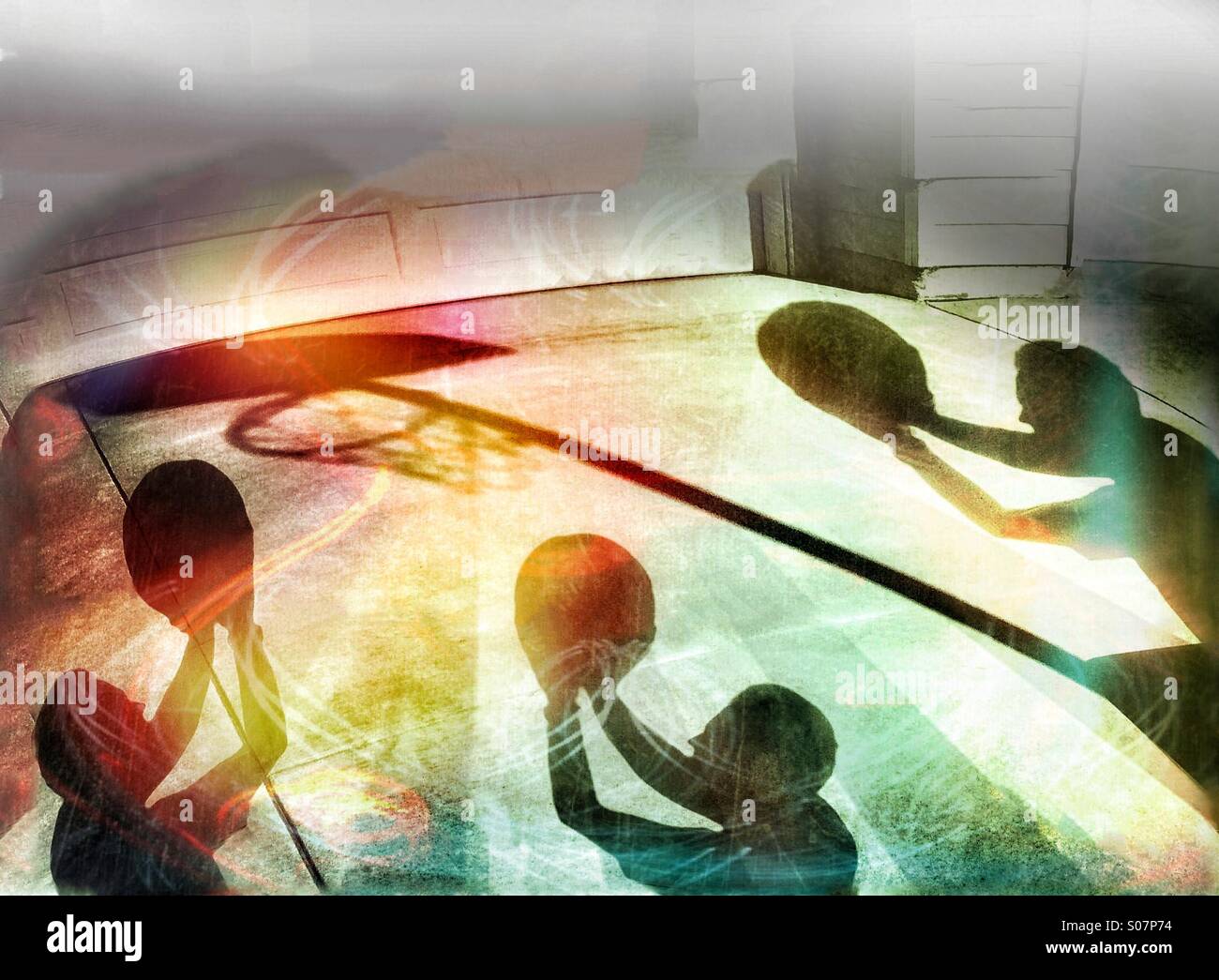 Triple Shadow Play, Having Fun Shooting Hoops In Basketball Stock Photo