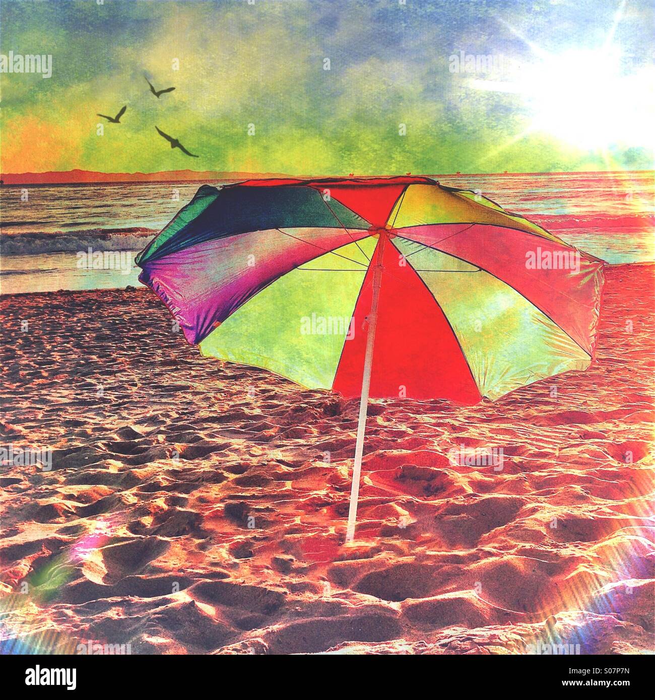 Colorful Beach Umbrella In The Sand Stock Photo Alamy