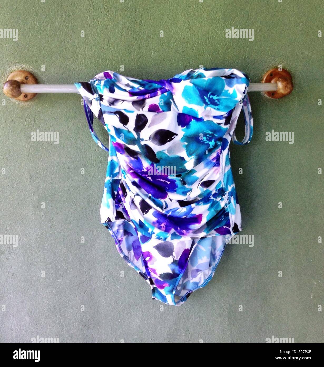 Bathing suit drying on an outside rack. Stock Photo