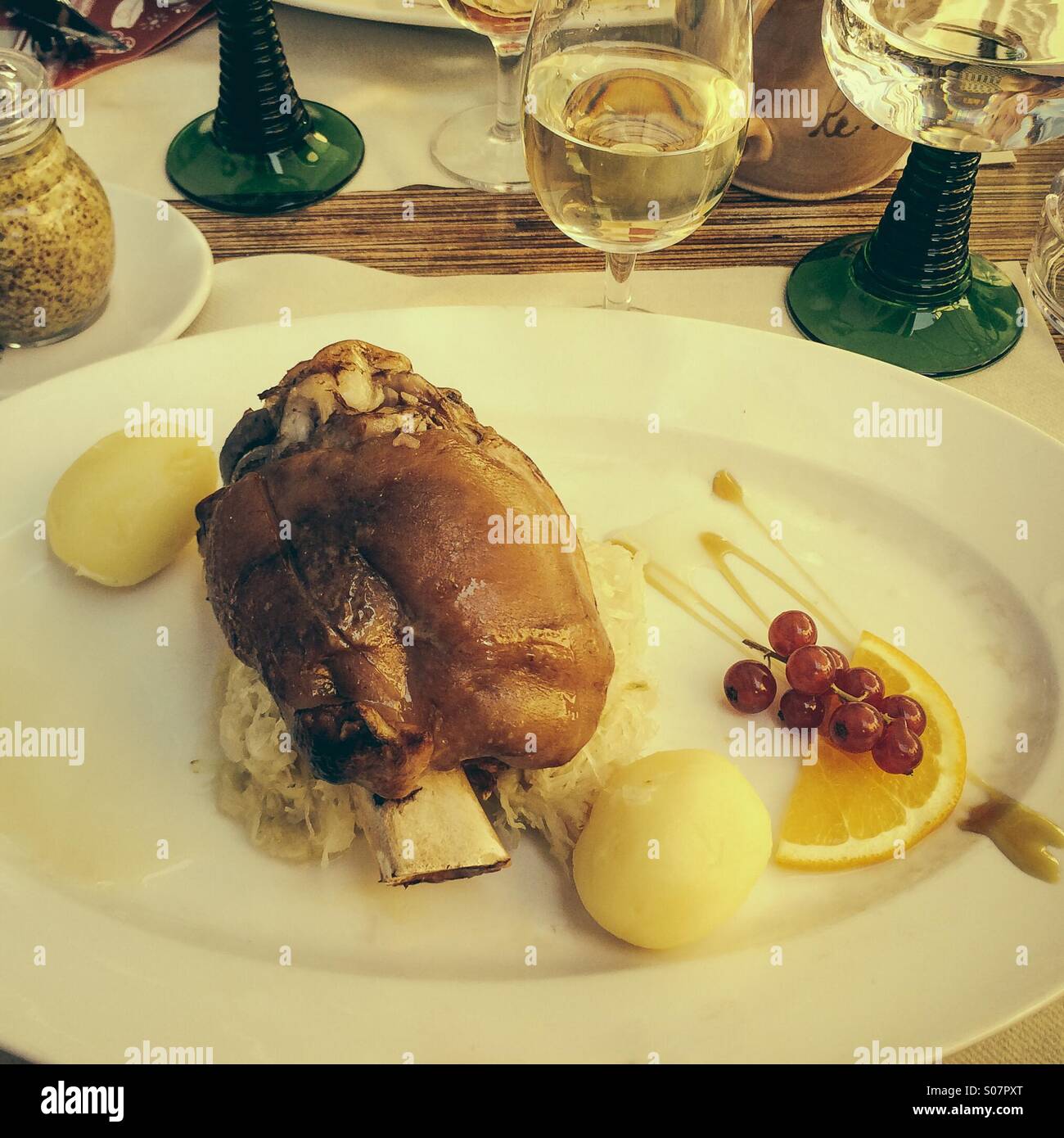 Traditional meal in Alsace of pork knuckle, choucroute and potatoes