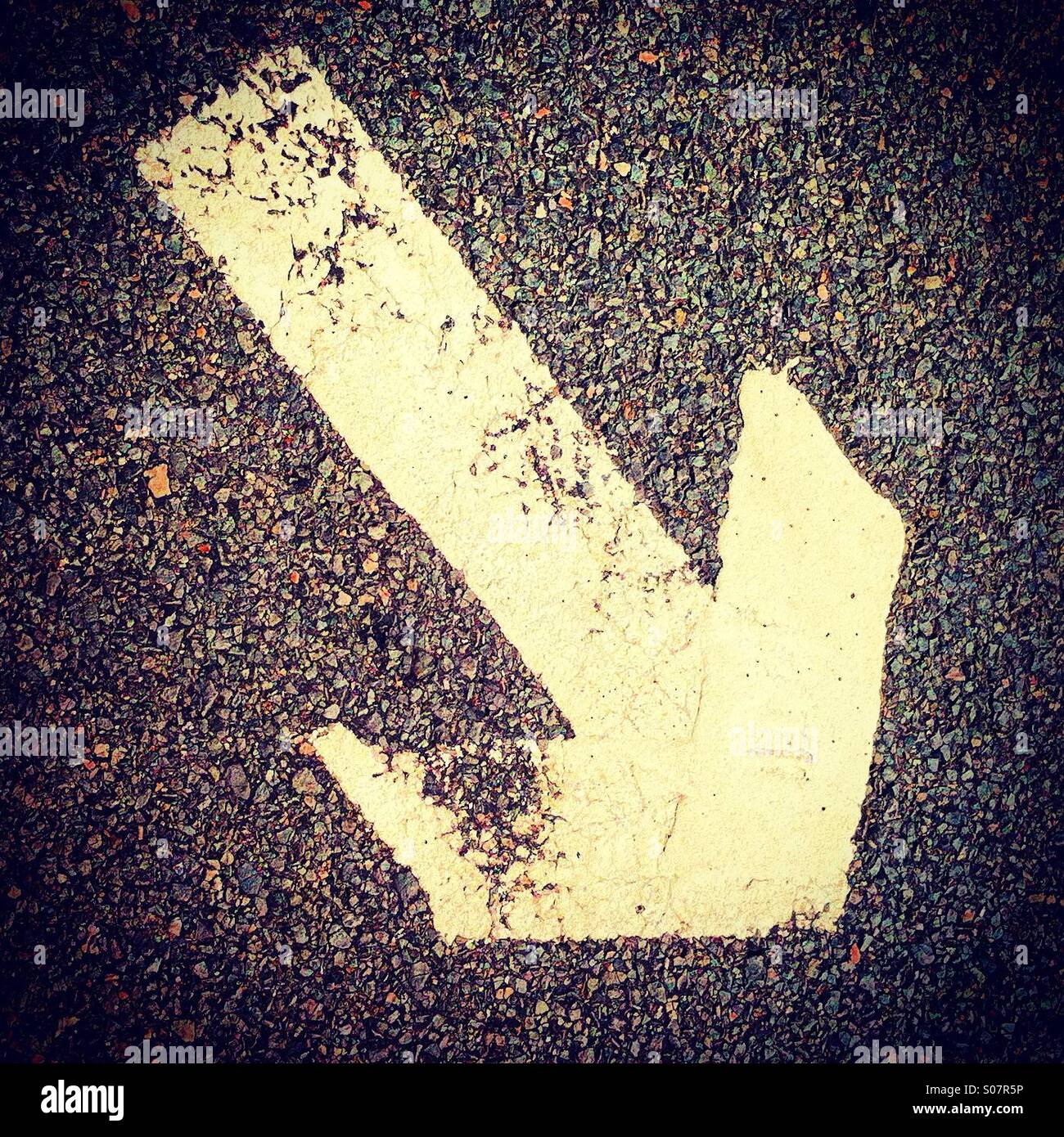 White arrow showing going down on the right - Smartphone Captured Stock Image