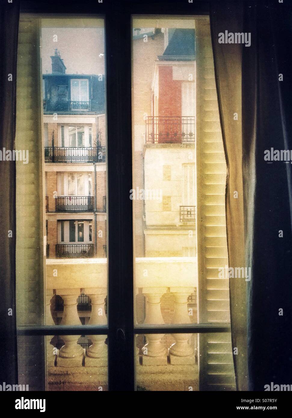 Window to balcony in Paris apartment Stock Photo