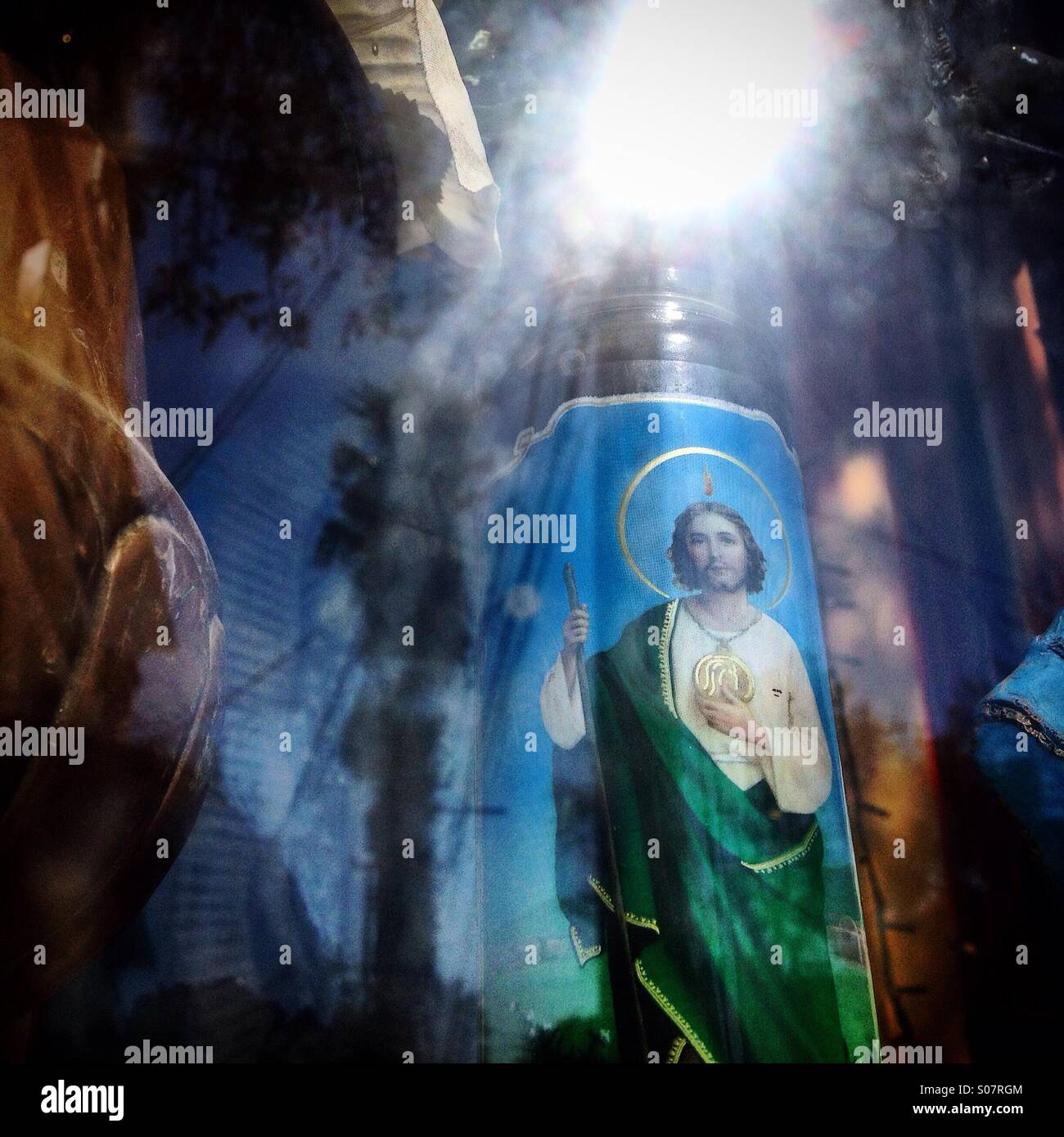 Reflection of the sun in an altar decorated with a Saint Jude Thaddeus altar in Colonia Roma, Mexico City,Mexico - Smartphone Captured Stock Image