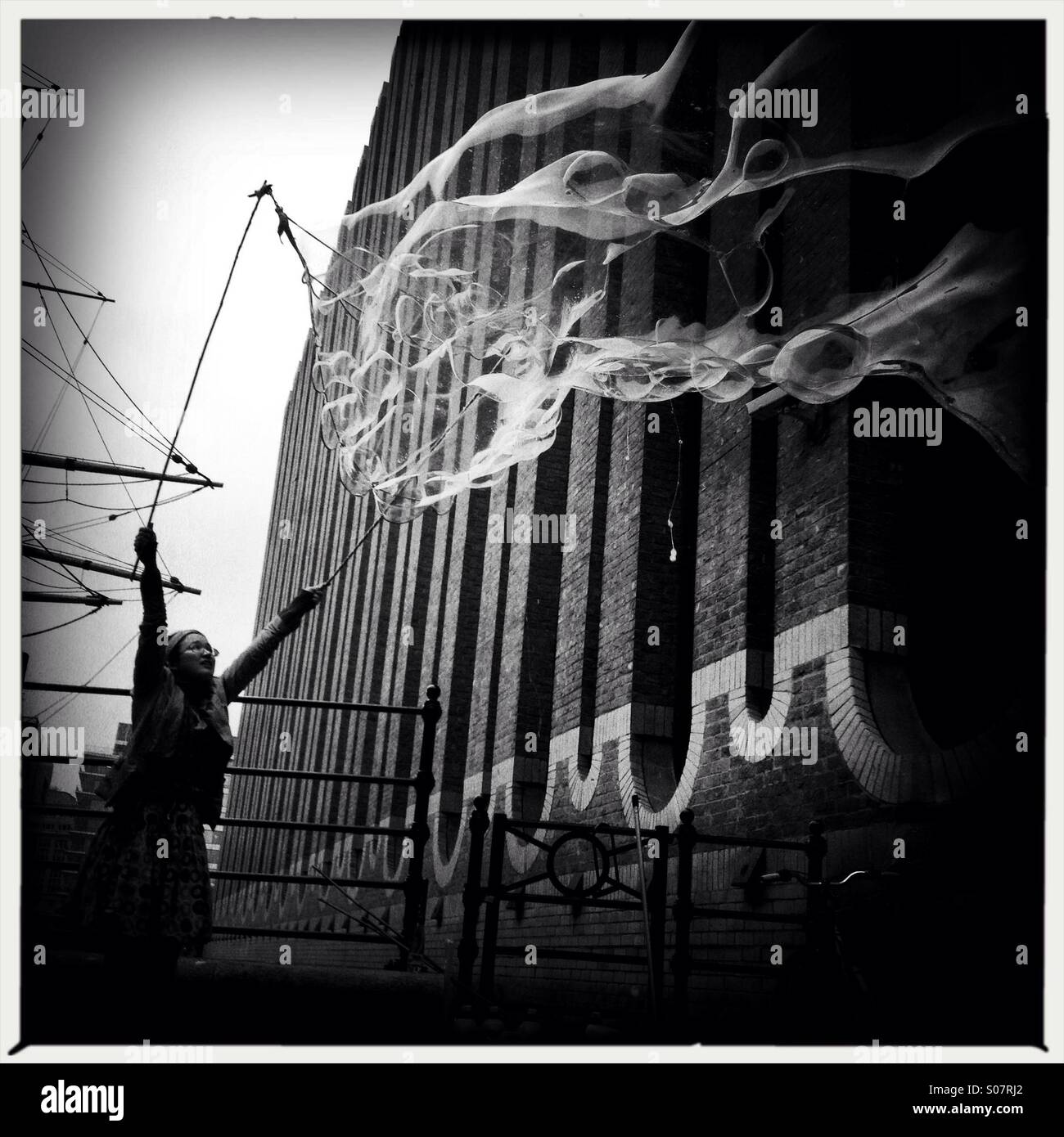 Street performer blowing bubbles in London southbank - Smartphone Captured Stock Image