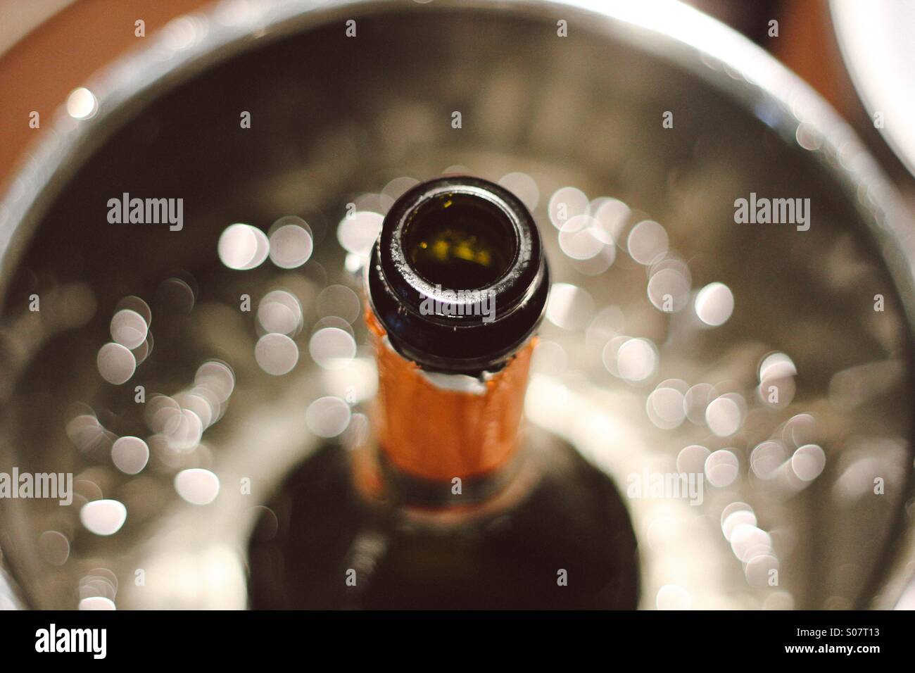 A bottle of champagne on ice Stock Photo