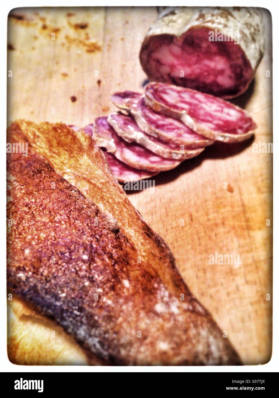 French baguette and dry sausage called saucisson. - Smartphone Captured Stock Image