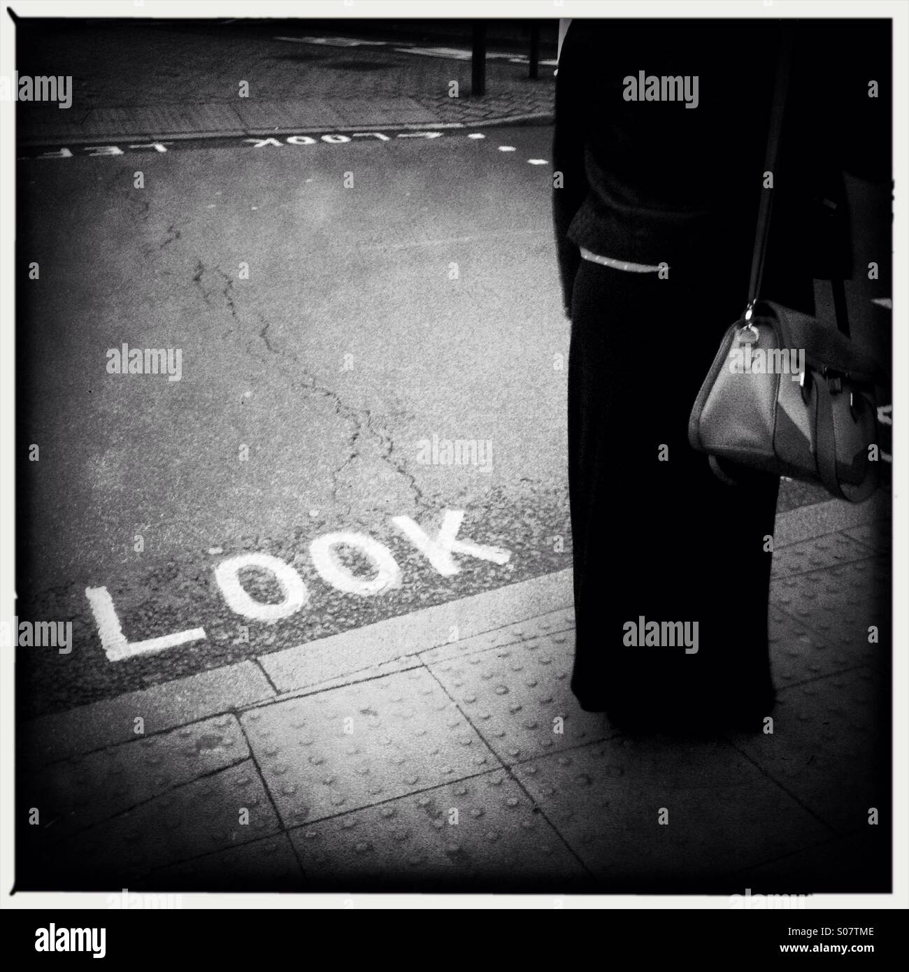 Woman by the pedestrian cross - Smartphone Captured Stock Image