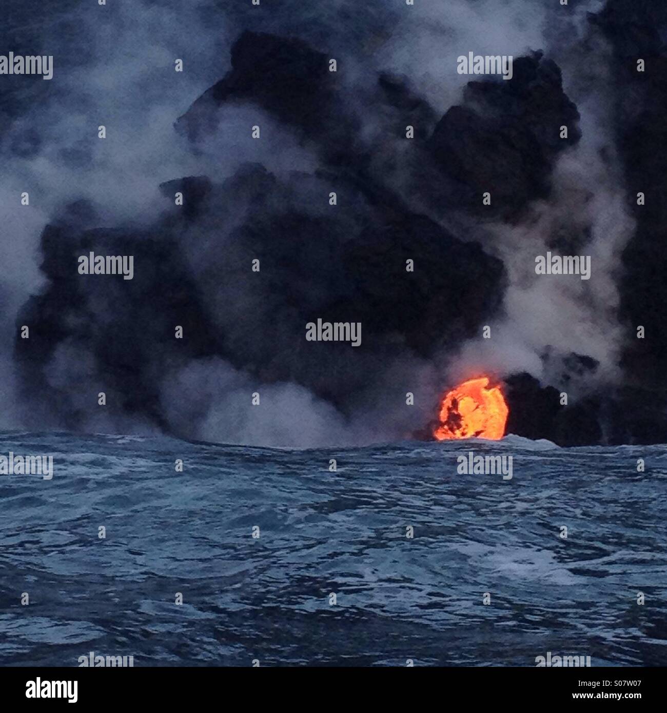 Lava flowing into the ocean, Kilauea Volcano, Big Island, Hawaii Stock