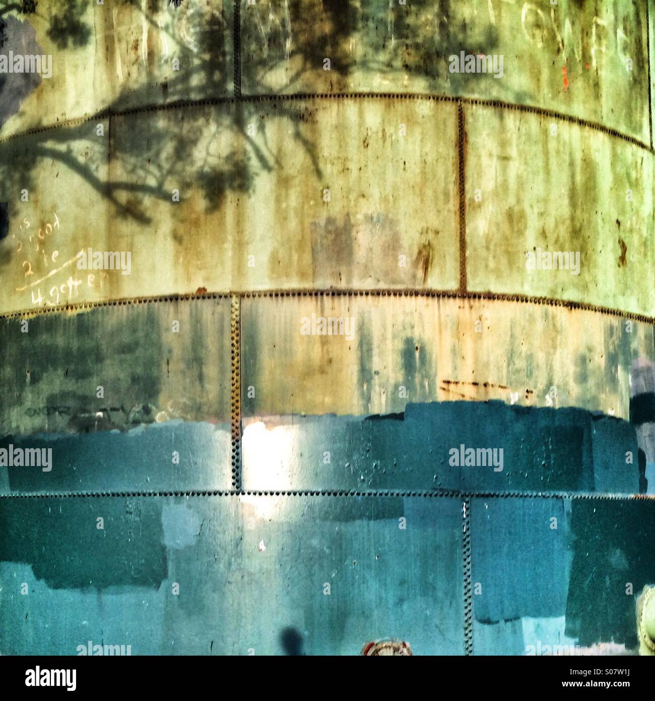 Painted water tank with tree shadow - Smartphone Captured Stock Image