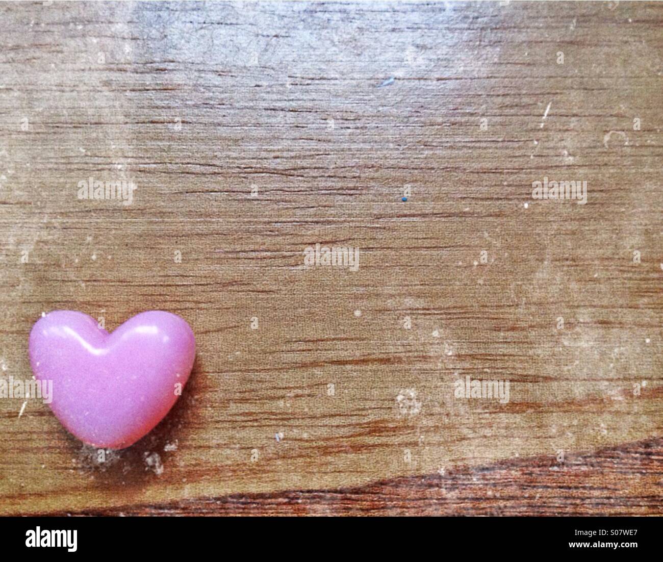 Heart bead on wood - Smartphone Captured Stock Image