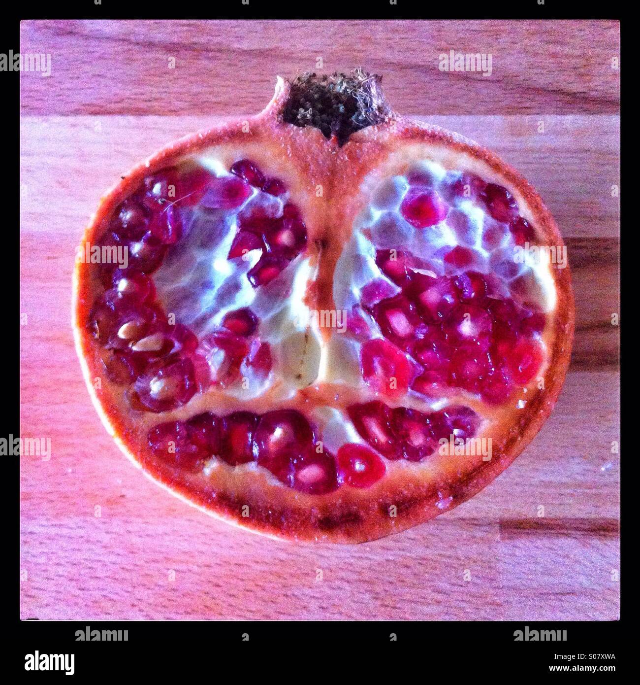 Pomegranate fruit halved - Smartphone Captured Stock Image