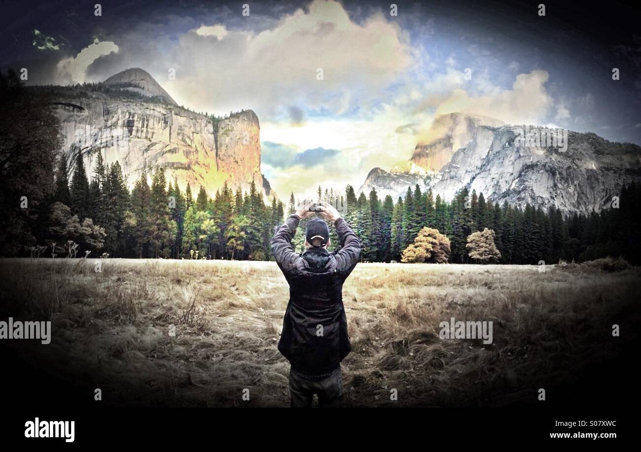 Man taking photo in Yosemite National Park, California - Smartphone Captured Stock Image