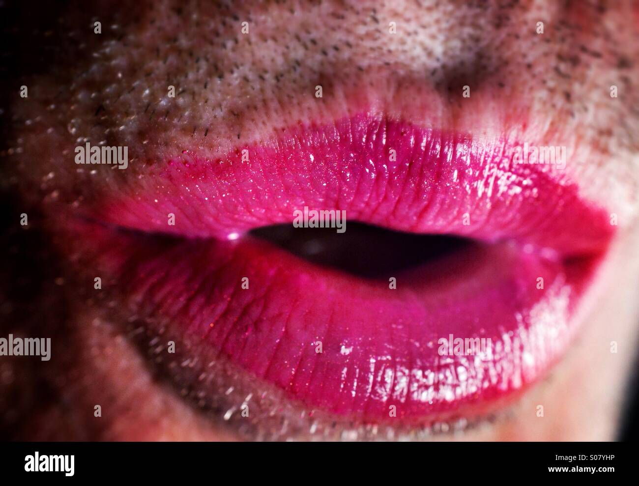 Close up of unshaven man wearing lipstick Stock Photo
