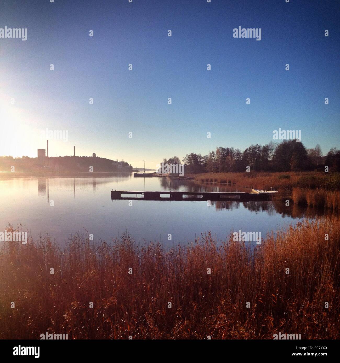 Still autumn fall water and piers in the working port west harbour of Mariehamn capital of Åland Finland archipelago Baltic Sea - Smartphone Captured Stock Image