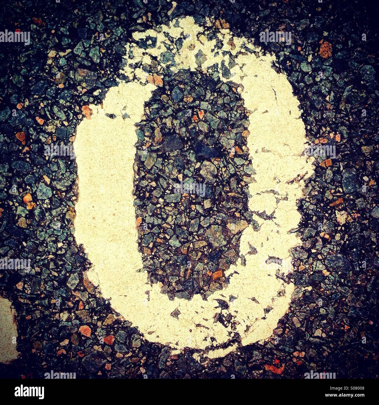 Letter O painted on the road in white color - Smartphone Captured Stock Image