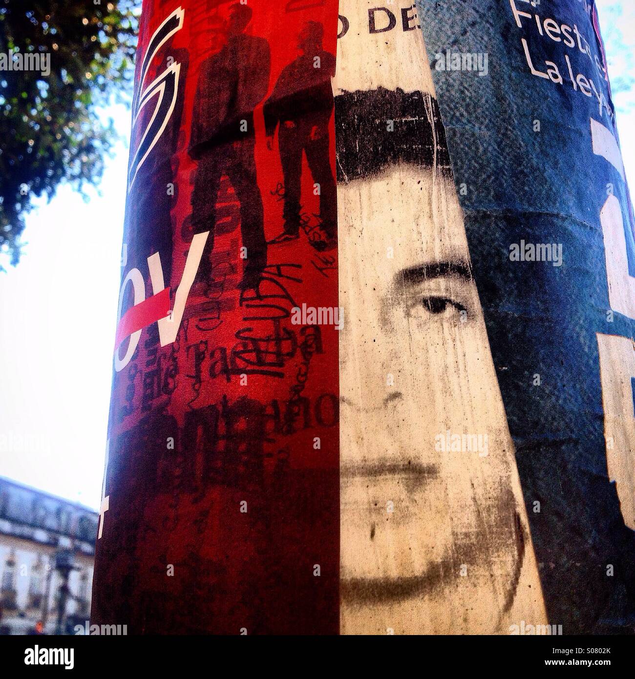 A portrait of Benjamin Ascensio Bautista, covered by advertising in Mexico City. Ascensio is one of the 43 missing students of Ayotzinapa dissapeared in Iguala, Guerrero, Mexico - Smartphone Captured Stock Image