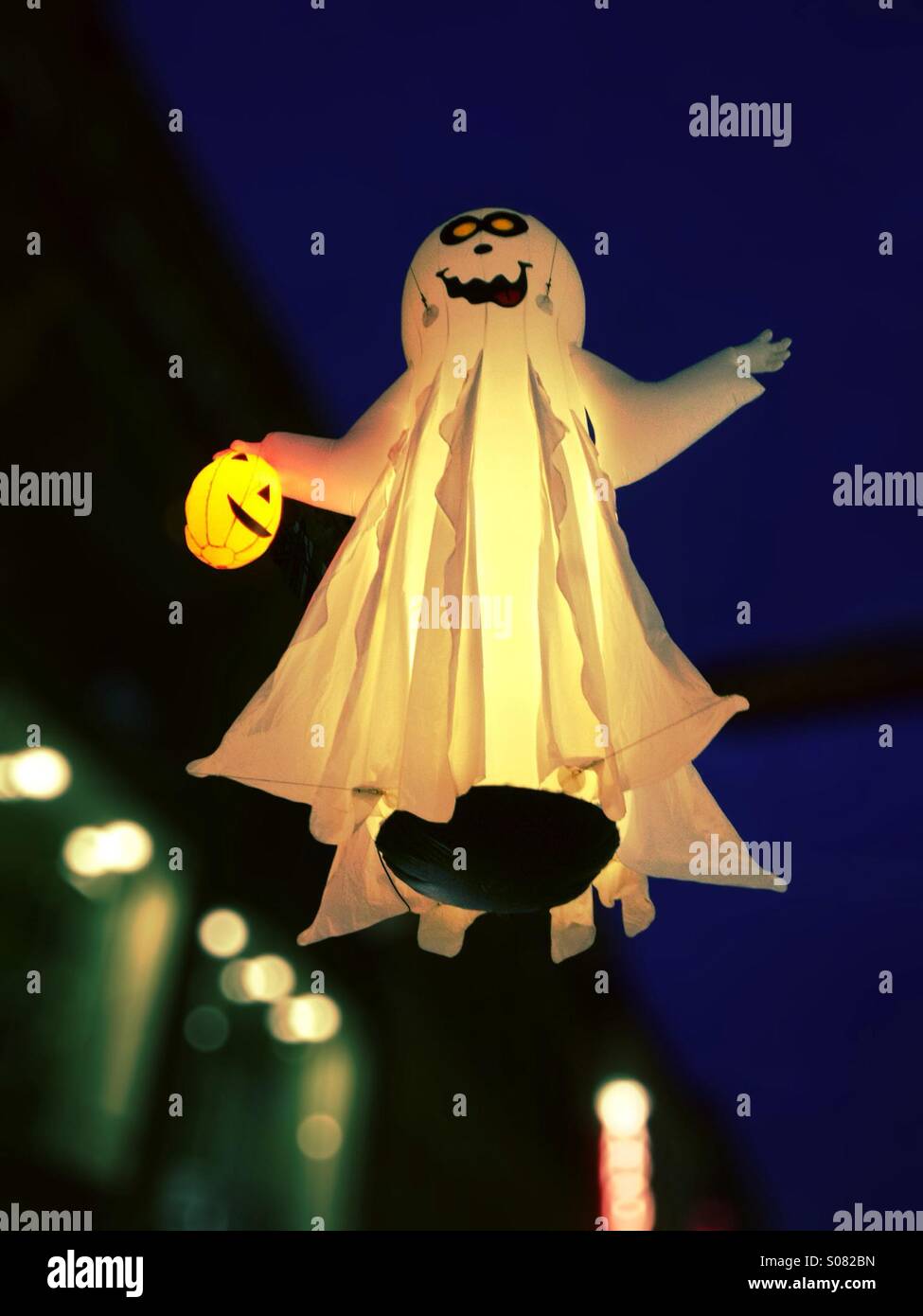 Ghost mannequin hanging in dusk sky at Halloween - Smartphone Captured Stock Image