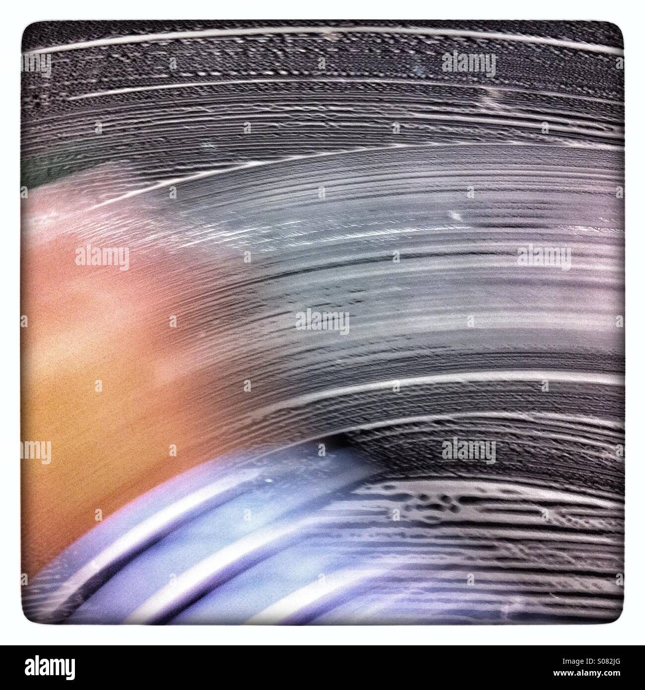 Blurred hand washing a black car - Smartphone Captured Stock Image