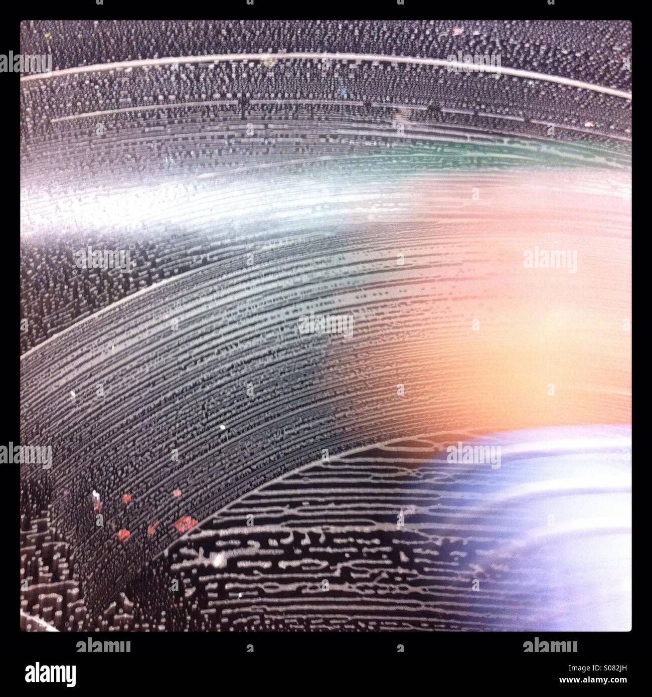 Blurred hand washing a black car - Smartphone Captured Stock Image