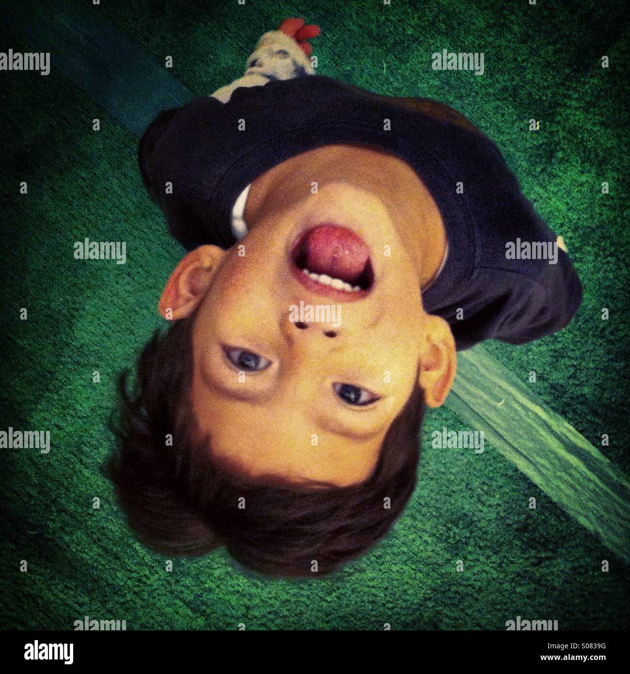 Kid upside down - Smartphone Captured Stock Image