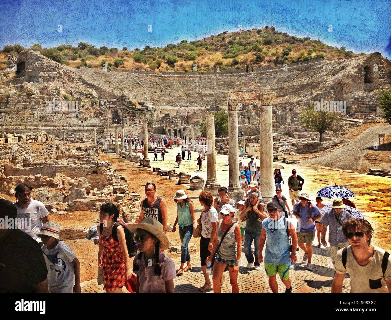 Tourists Walking Along The Arcadian Way, away from The Great Theatre at the Ancient City of Ephesus (EFES) in the Aegean Area of Turkey. Ephesus is on the Tentative List of UNESCO World Heritage Sites - Smartphone Captured Stock Image