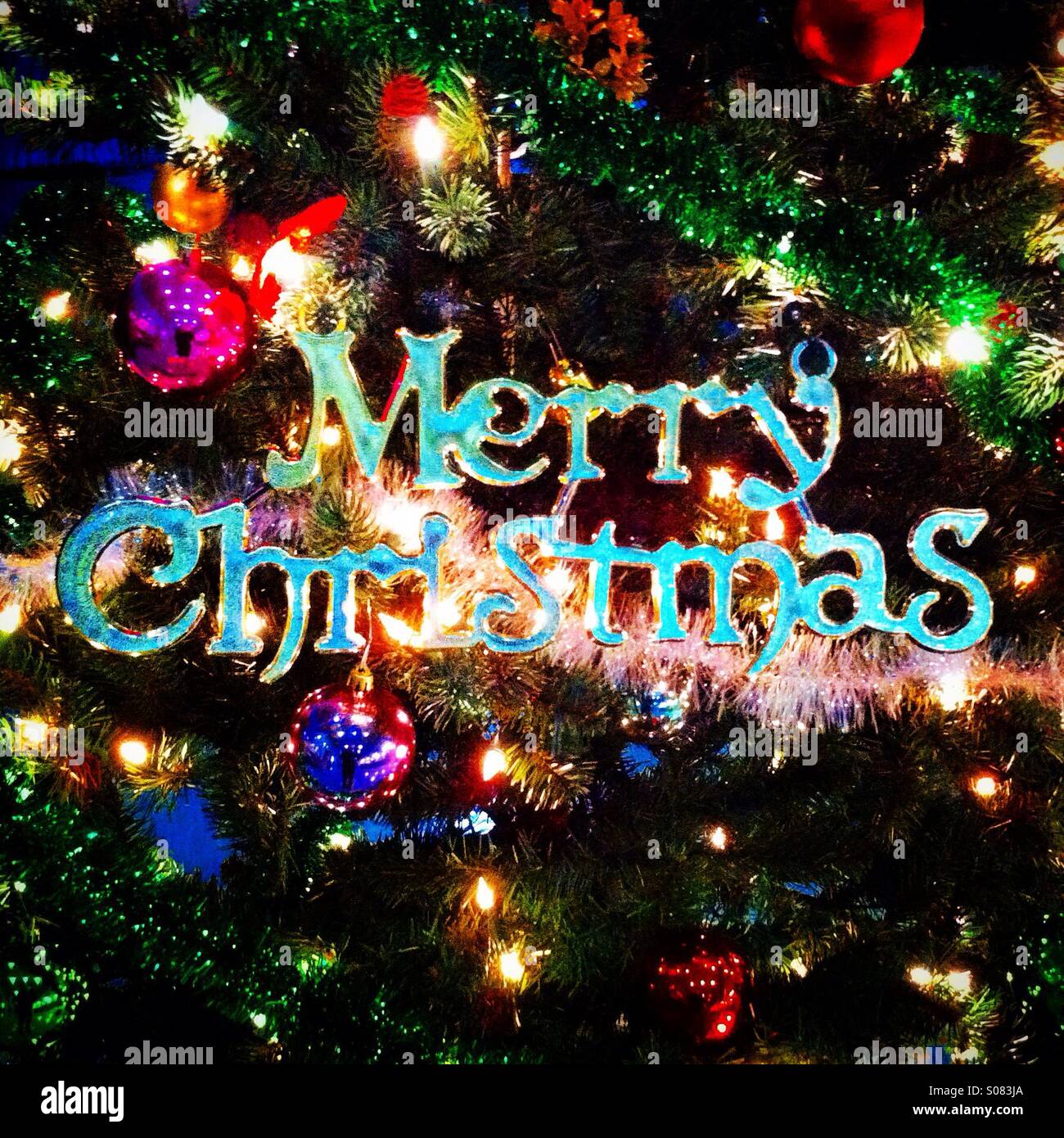 Merry christmas decoration on a xmas tree - Smartphone Captured Stock Image