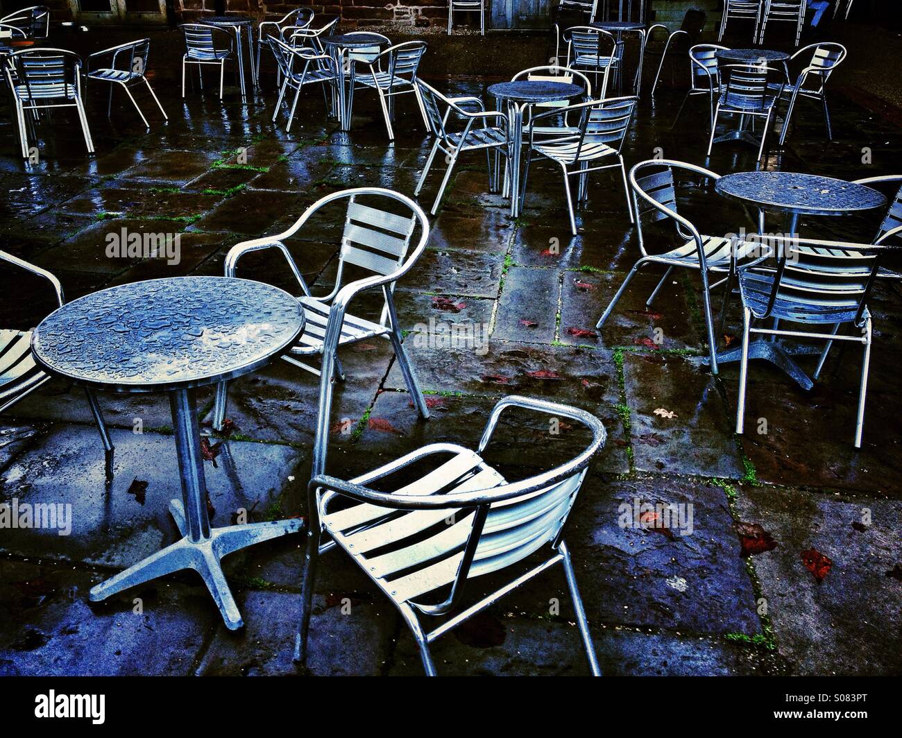 Metal table and chairs after rain shower - Smartphone Captured Stock Image