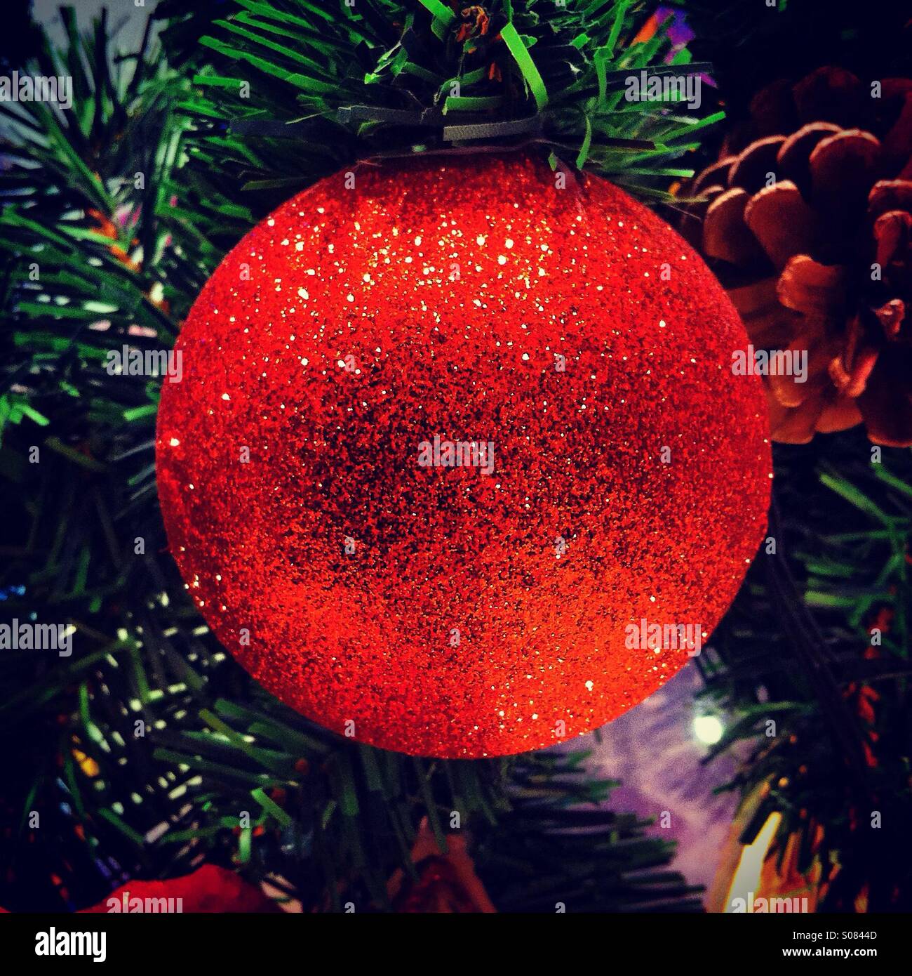 Shiny red tectured christmas ball - Smartphone Captured Stock Image