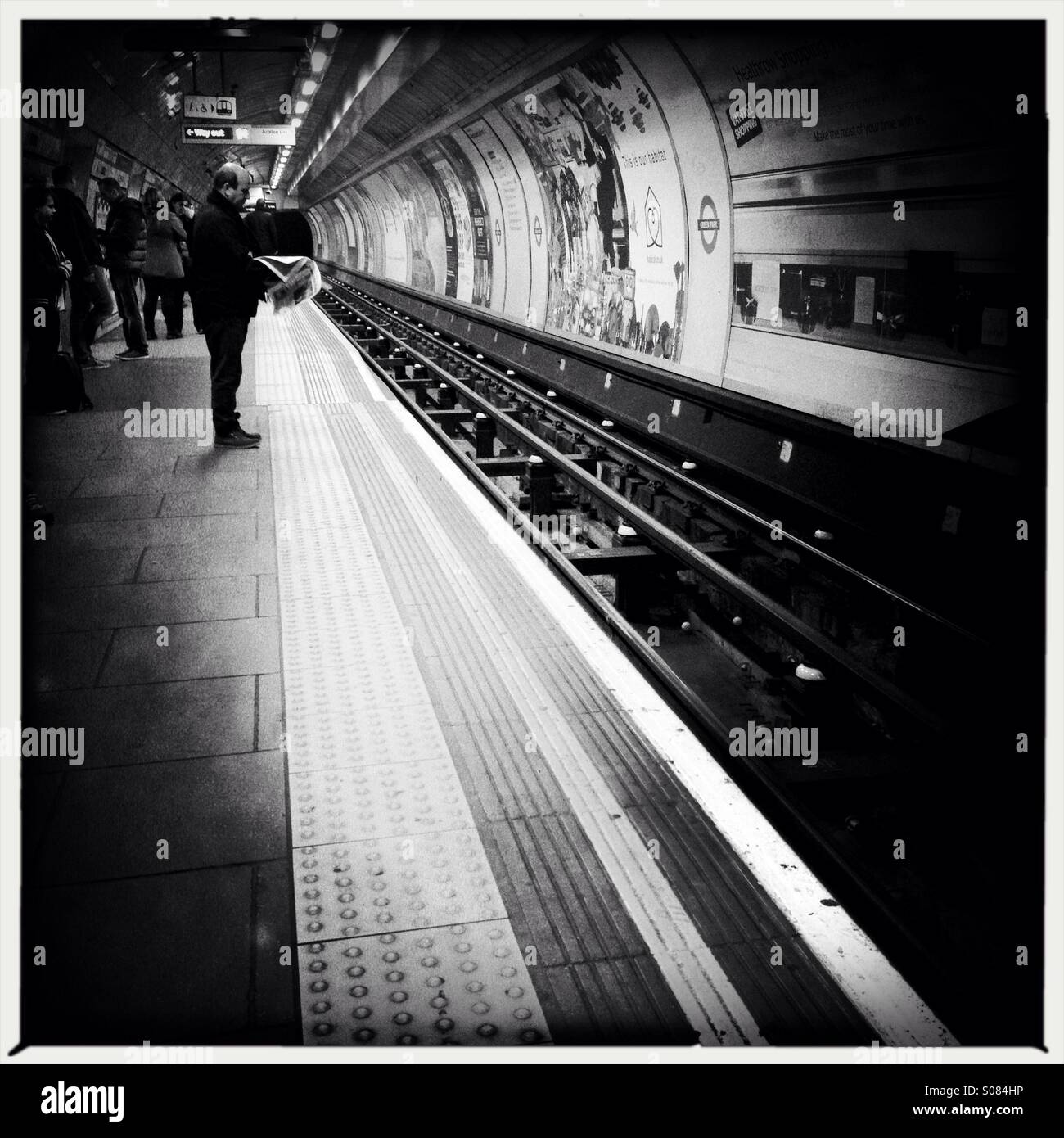 Commuters waiting for London Underground train - Smartphone Captured Stock Image