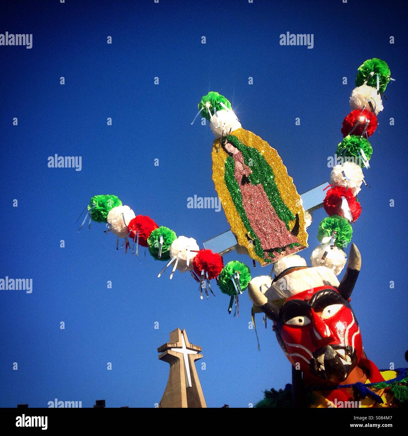 Masked devil at the pilgrimage to the Our Lady of Guadalupe Basilica,Mexico City, Mexico. Dancers from Chocaman, Veracruz, perform Saint James dance representing victory of the apostle over the Devil - Smartphone Captured Stock Image